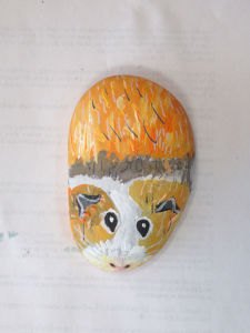 Hamster peint sur un galet