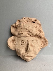 Masque en terre cuite