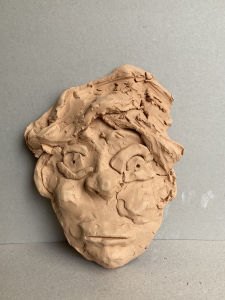 Masque en terre cuite